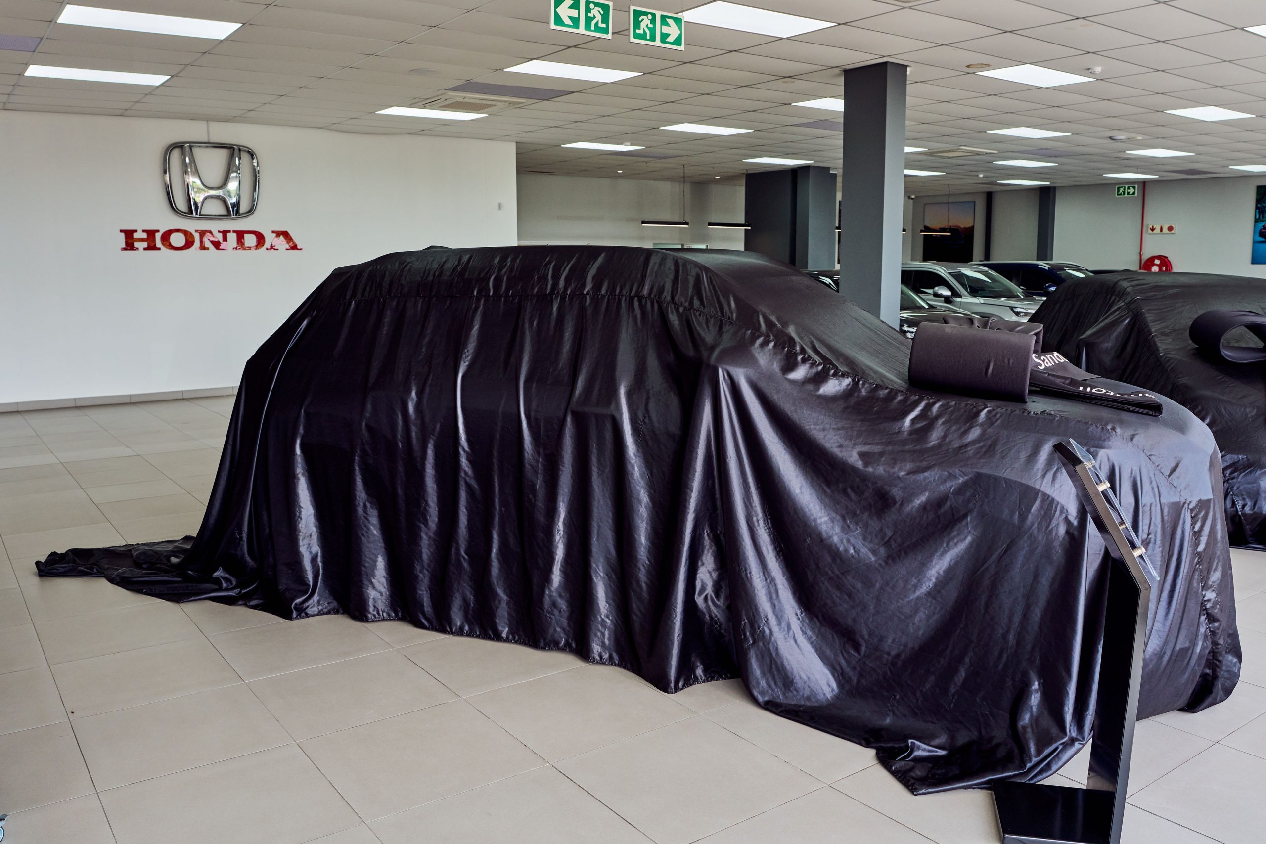 Honda logo wall inside the Honda Auto Sandton dealership